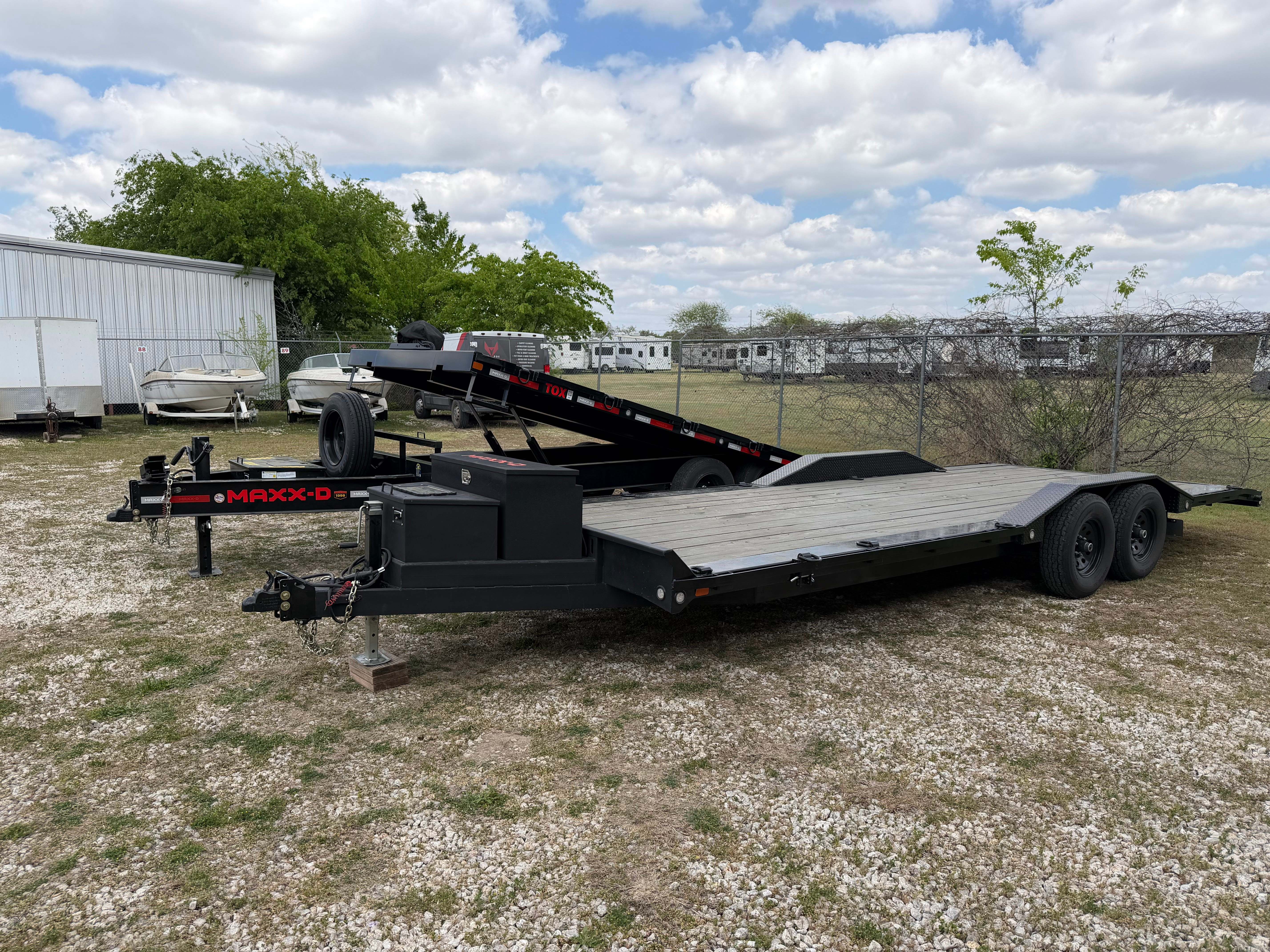 Maxx-D car hauler showing brand logo and front storage box