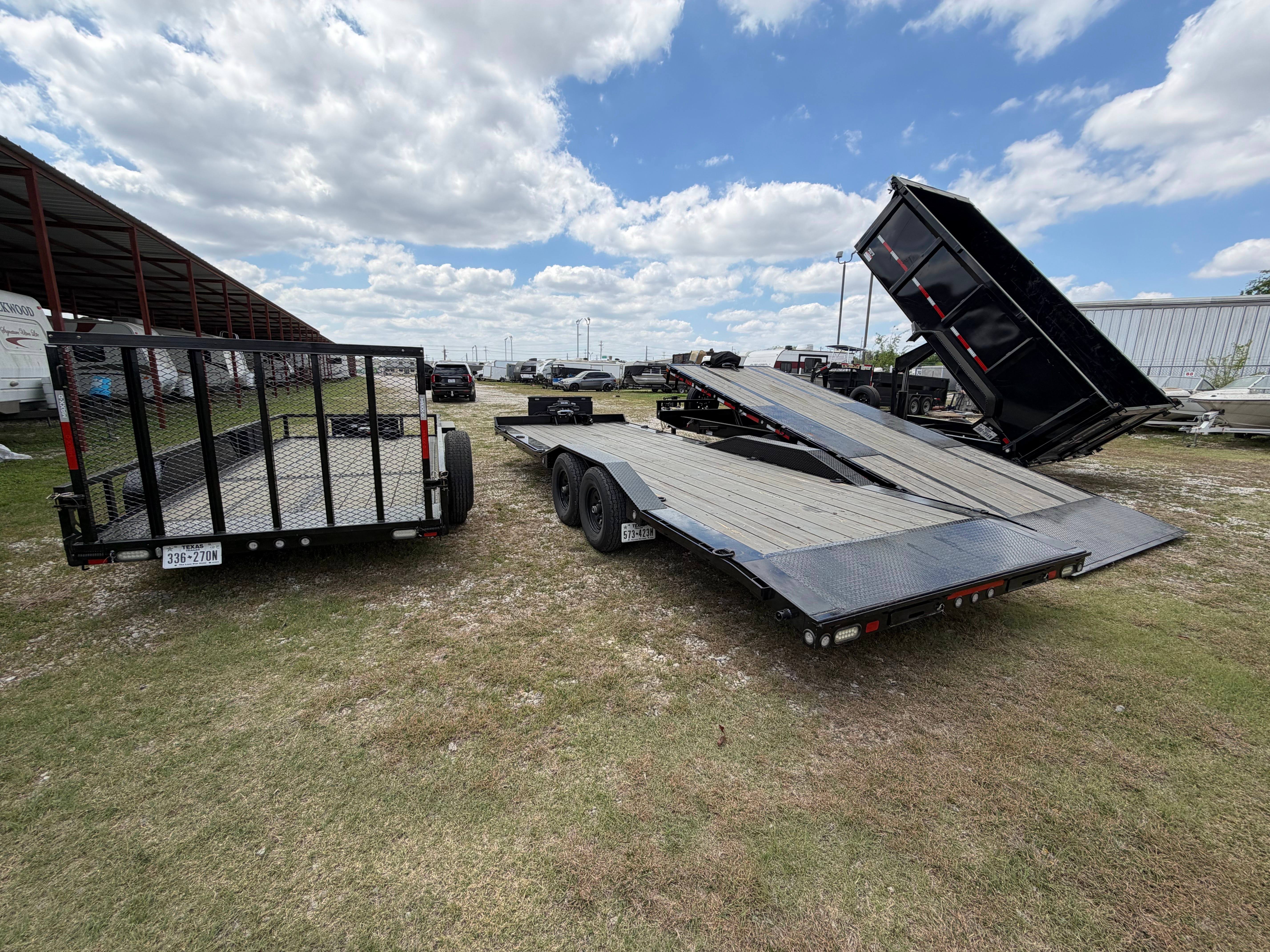 Chapman Trailer Rentals fleet showing utility, car hauler, and dump trailers